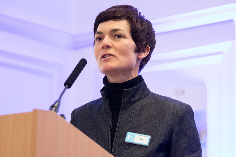 Dame Ellen MacArthur standing at lectern launching new three-year Ambitions.