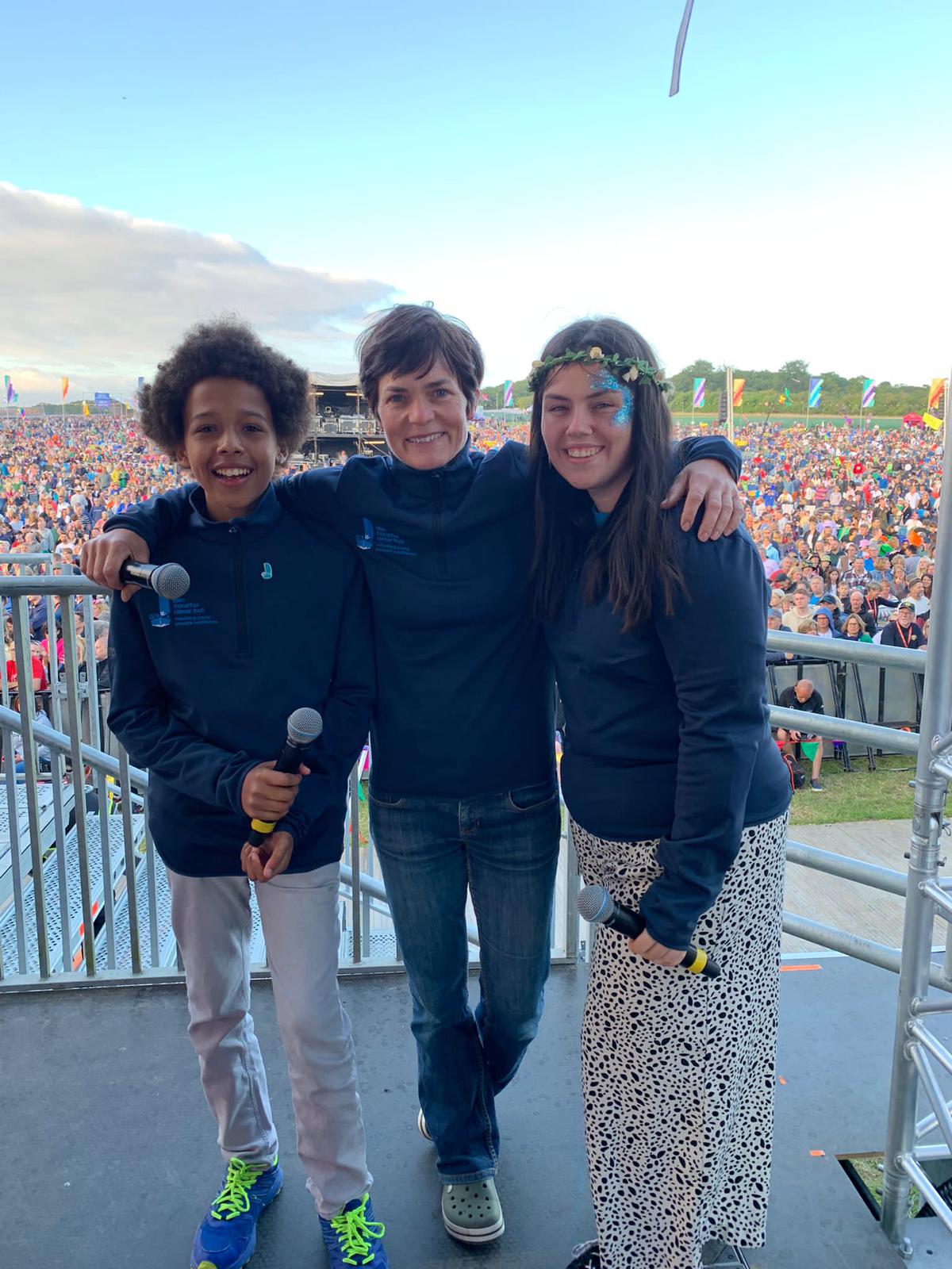 Dame Ellen MacArthur joins Trust ambassadors, Emmanuel and Macy, on stage at CarFest South in August 2021