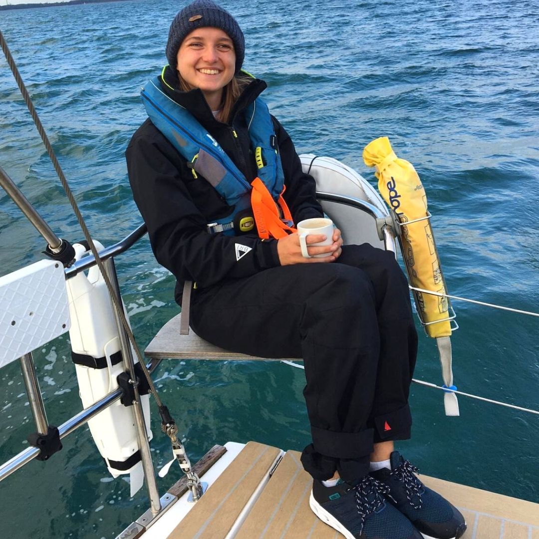 Emily Wright sat having a cup of tea while sailing 