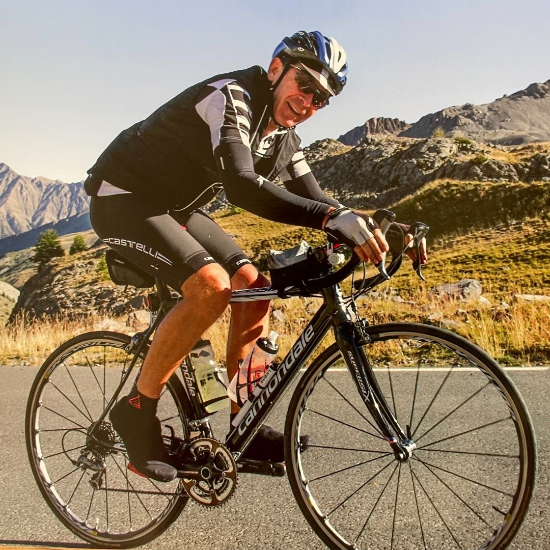 Ian Wright cycling through the mountains