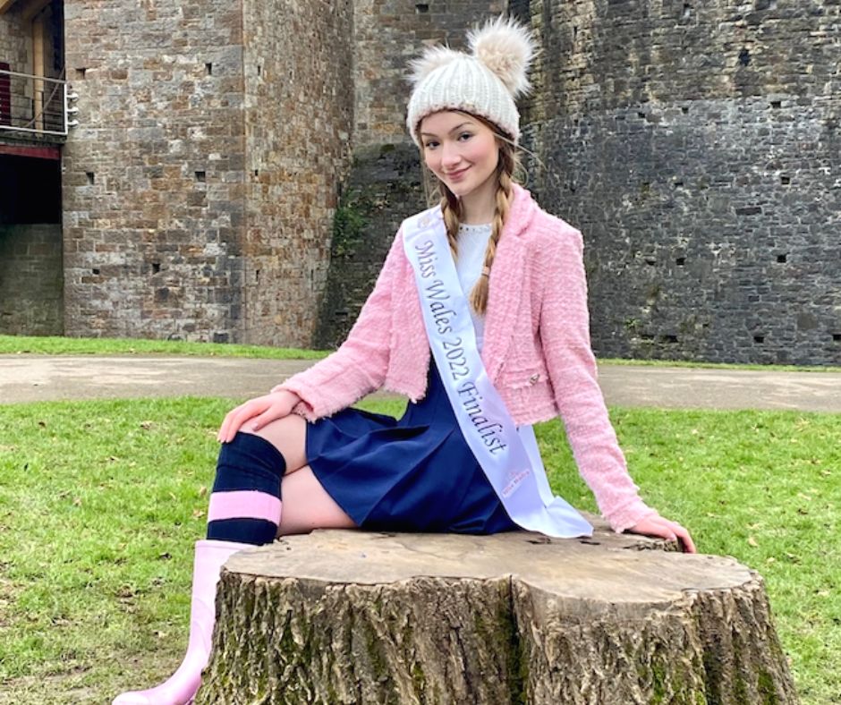 Alys posing outside of a castle as the Miss Wales finalist 