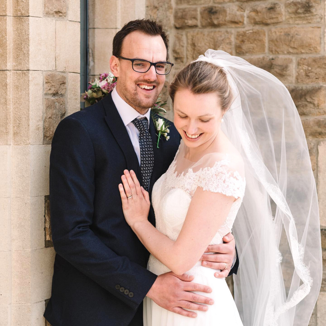 Dan Bishop pictured smiling with his wife on their wedding day