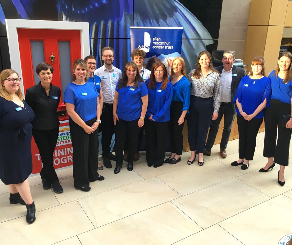 The Trust team lined up at people's Postcode Lottery offices